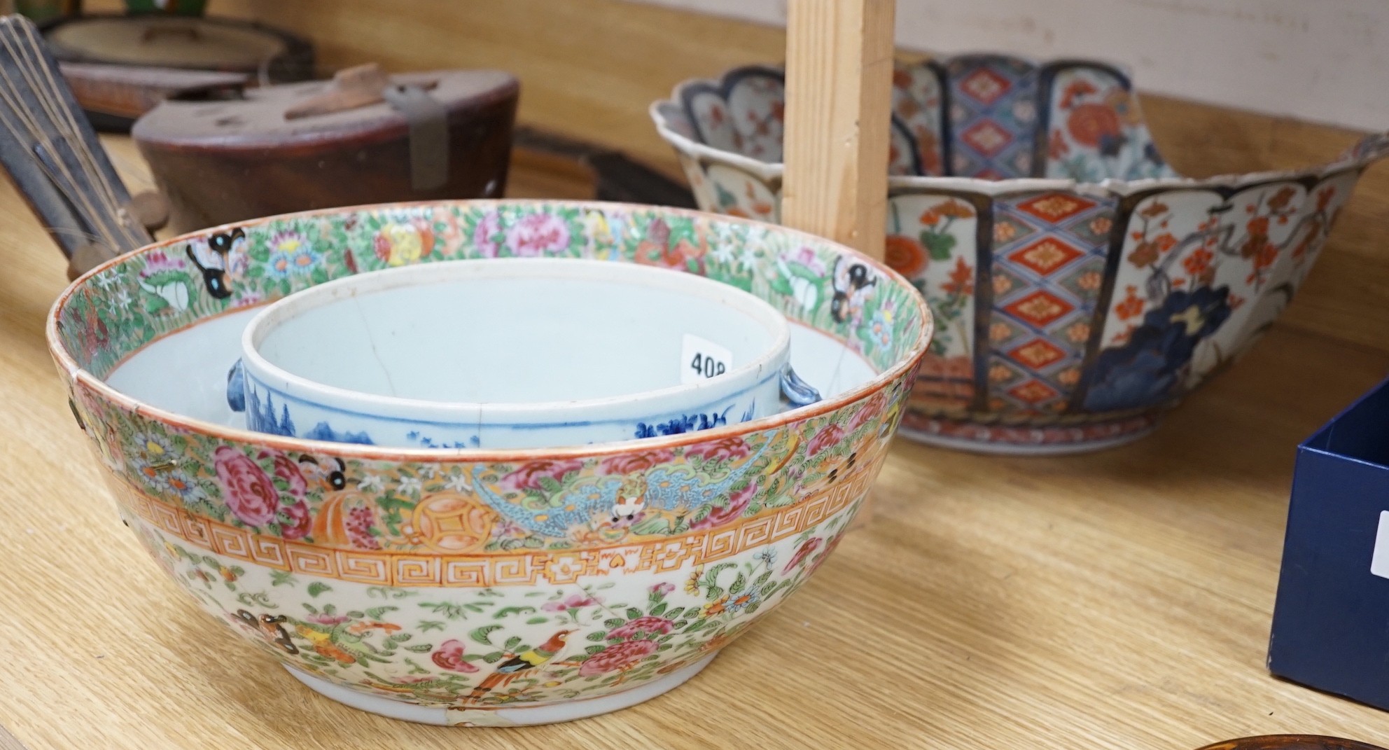 A 19th century Imari bowl, a famille rose bowl and one other- all damaged